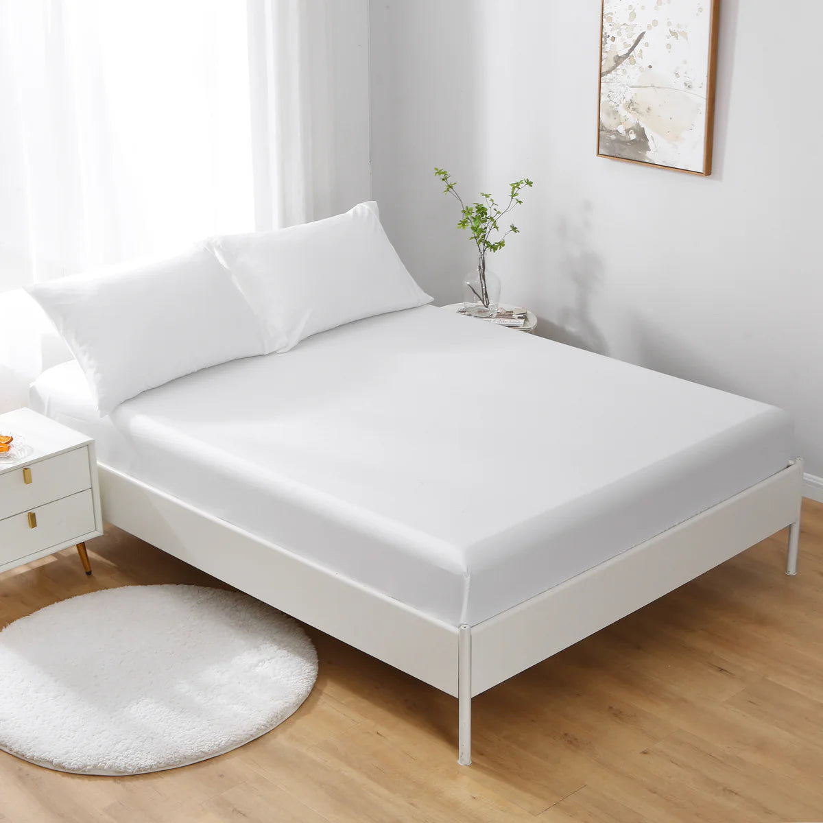White 100% cotton 17 inch deep pocket fitted sheet on bed with pillows and round rug