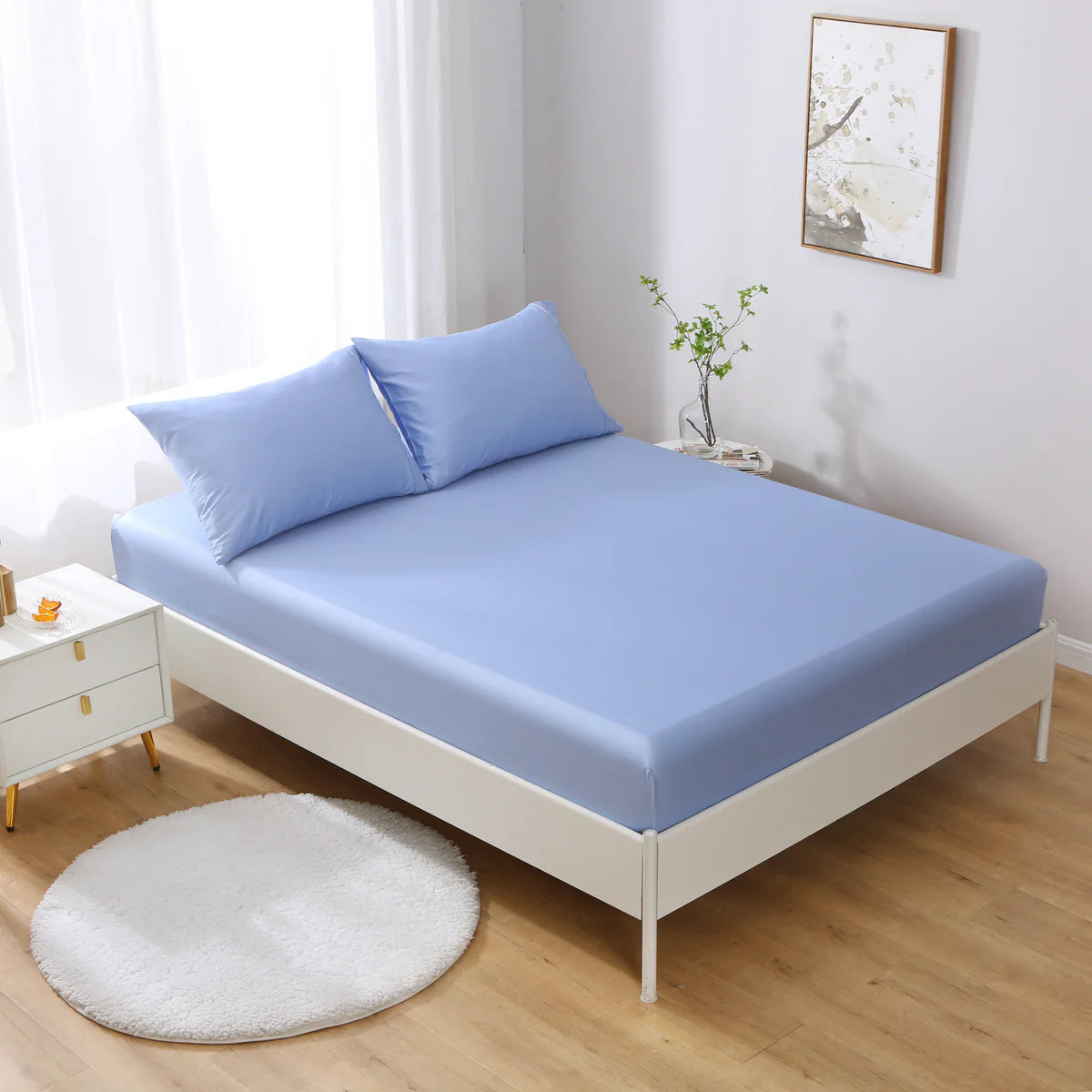 Pale Blue 100% cotton deep pocket fitted sheet on bed with matching pillowcases